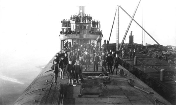 black and white photo of citizens abord the whaleback barge C. W. Wetmore February 1892